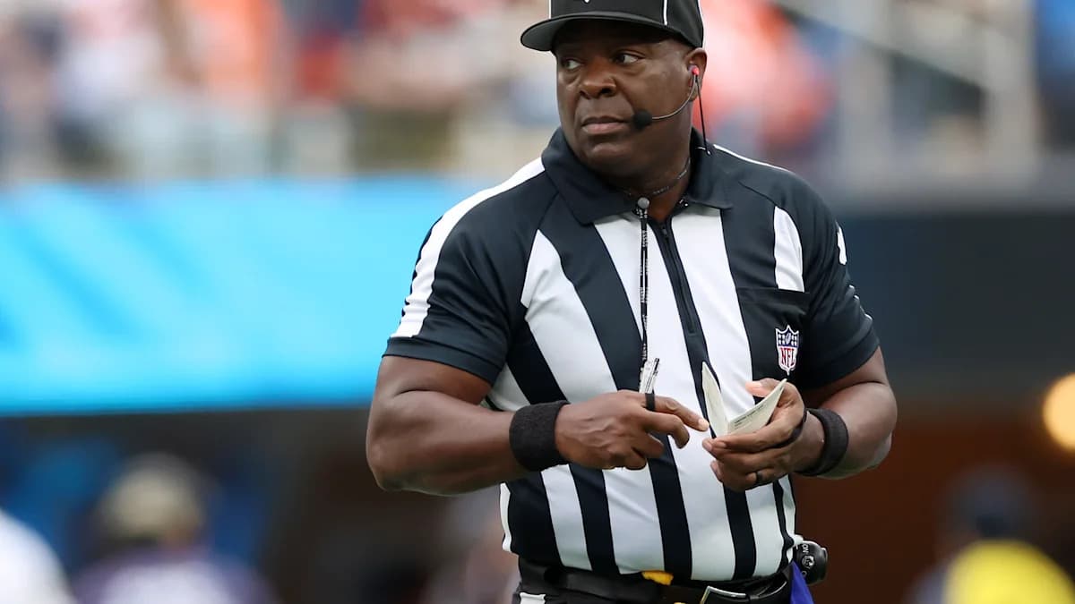 NFL umpire Larry Smith carted off early after slipping on wet field in London
