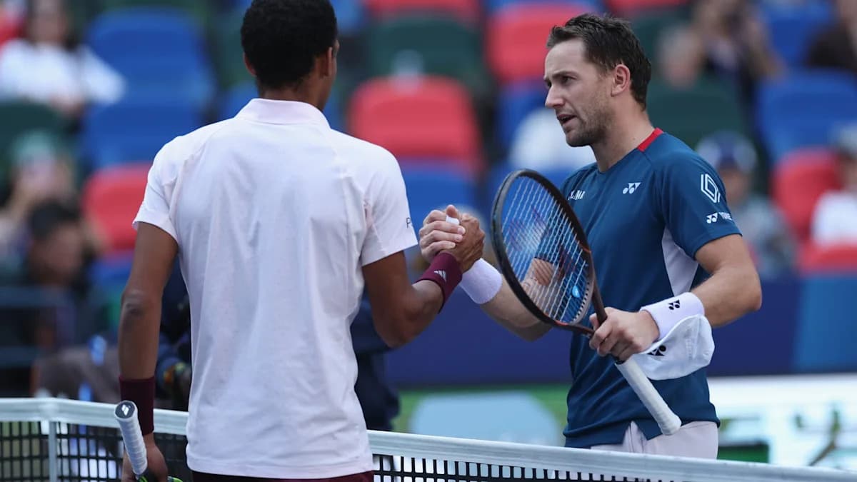 Casper Ruud reacts as Felix Auger-Aliassime retires from their match in Shanghai due to injury