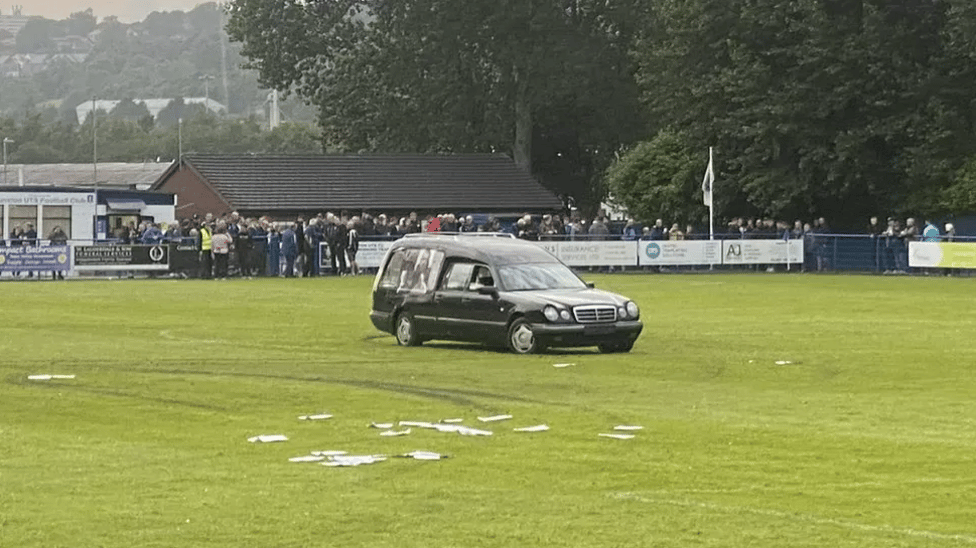Five charged over football pitch hearse disorder