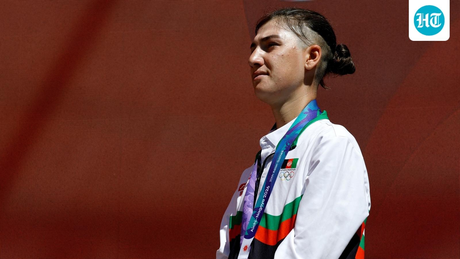 Afghanistan cyclist who disguised herself as a man to escape Taliban wins Asian Games silver